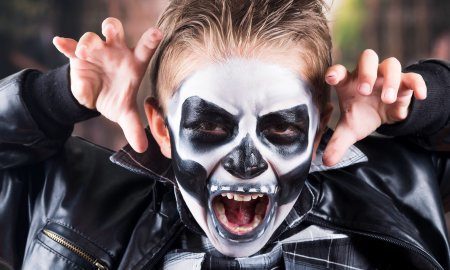 Boy Wearing Skull Makeup For Halloween