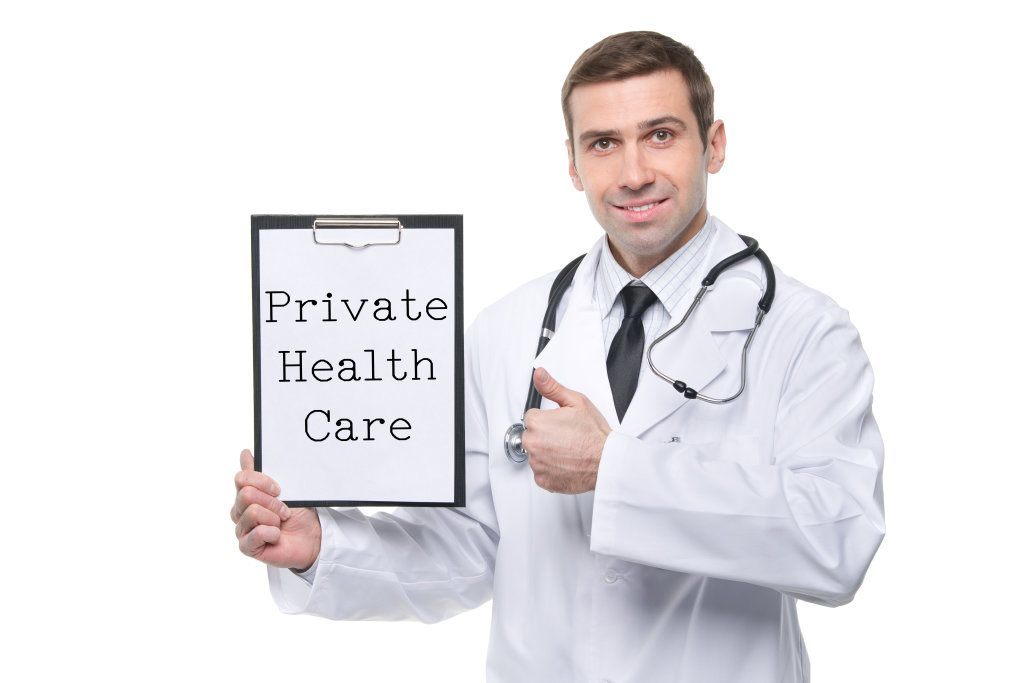 Male Doctor With Clipboard With Private Health Care