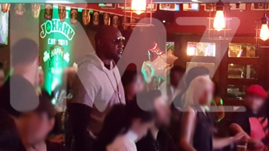 Lamar at a bar